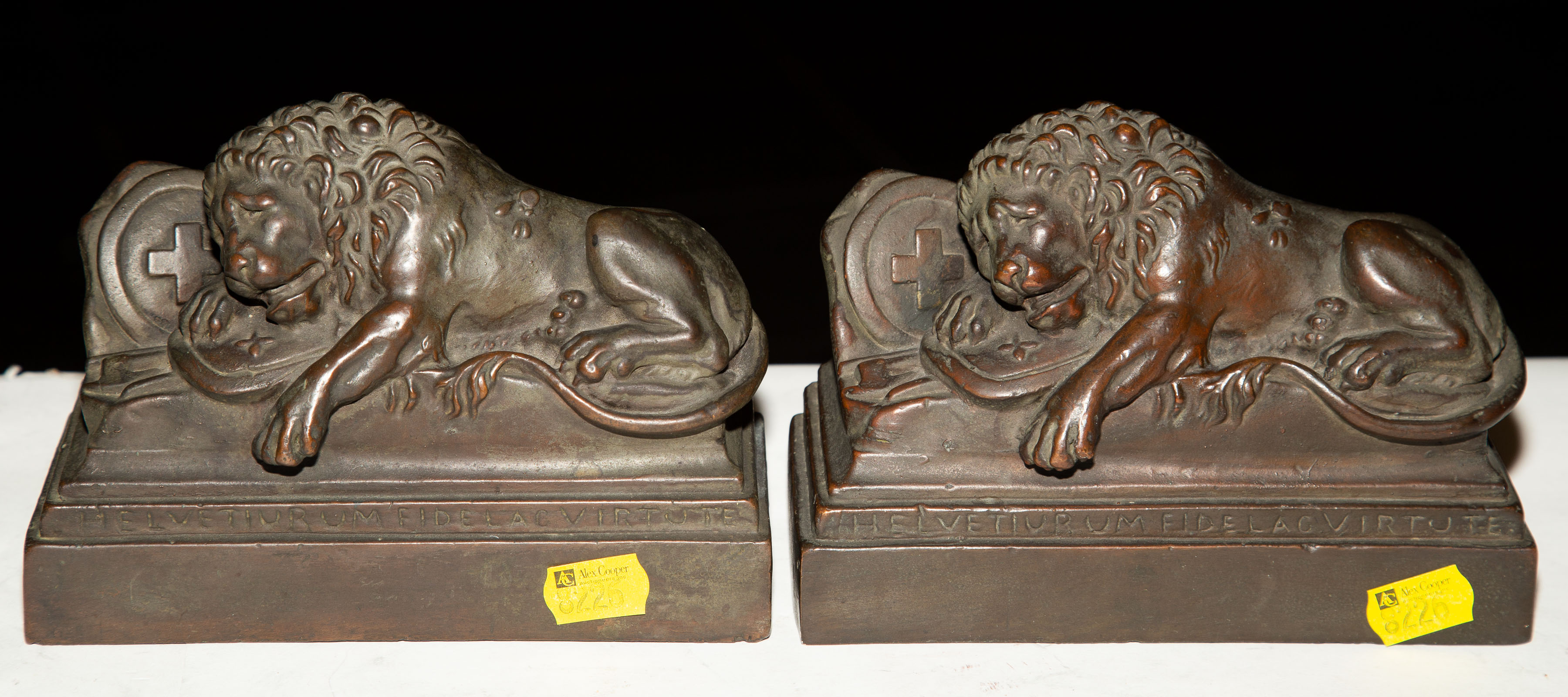 A PAIR OF BRONZED PLASTER LION OF