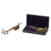 A PAIR OF CANDLE SNUFFERS AND