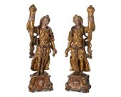 A PAIR OF CARVED GILTWOOD FIGU