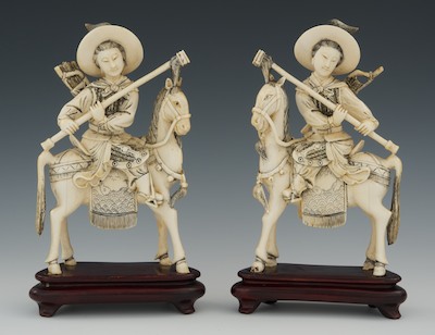 A Pair of Carved Ivory Figures on