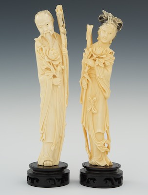 A Pair of Carved Ivory Attendants