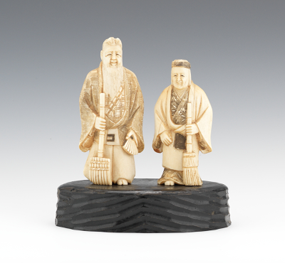 A Pair of Carved Ivory Longevity