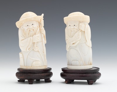 A Pair of Carved Ivory Figures