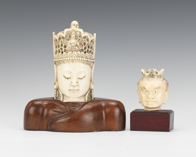A Pair of Carved Ivory Heads Two