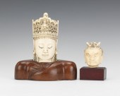 A Pair of Carved Ivory Heads T