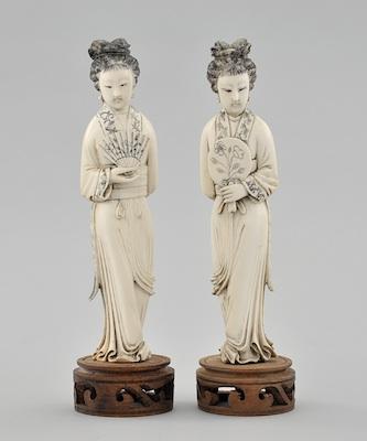 A Pair of Carved Ivory Figurines of