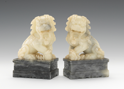 A Pair of Carved Jade Foo Dogs Both
