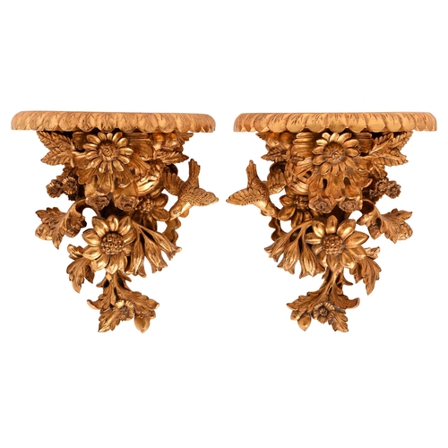 A pair of carved wood wall