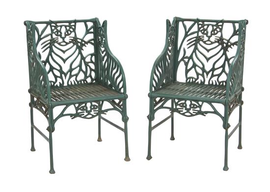 * A Pair of Cast Iron Chairs