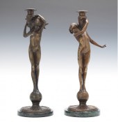A Pair of Cast Bronze Candlest