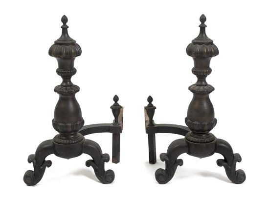 A Pair of Cast Iron Andirons each
