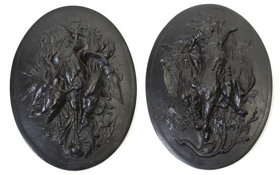 A Pair of Cast Iron Plaques each of