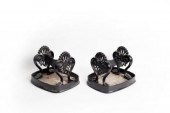 A pair of cast iron boot scrap