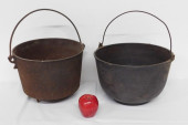 A PAIR OF CAST IRON KETTLES OR