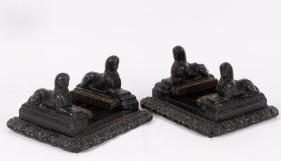 A pair of cast iron boot scrapers