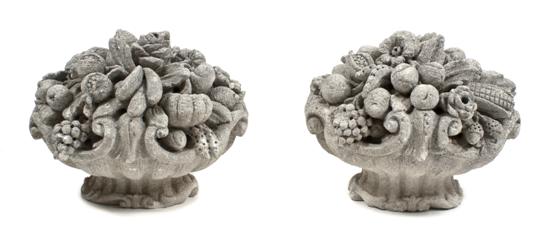 A Pair of Cast Stone Urns each