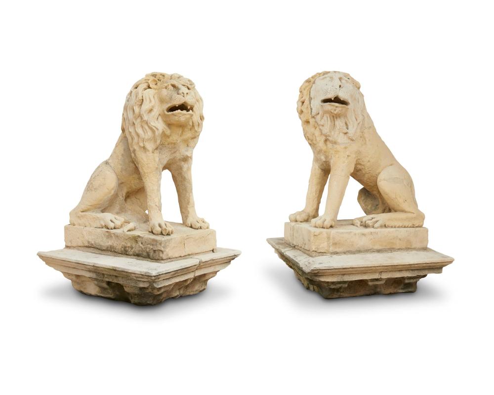 A PAIR OF CAST STONE LION
