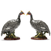 A PAIR OF CERAMIC GUINEA FOWL<
