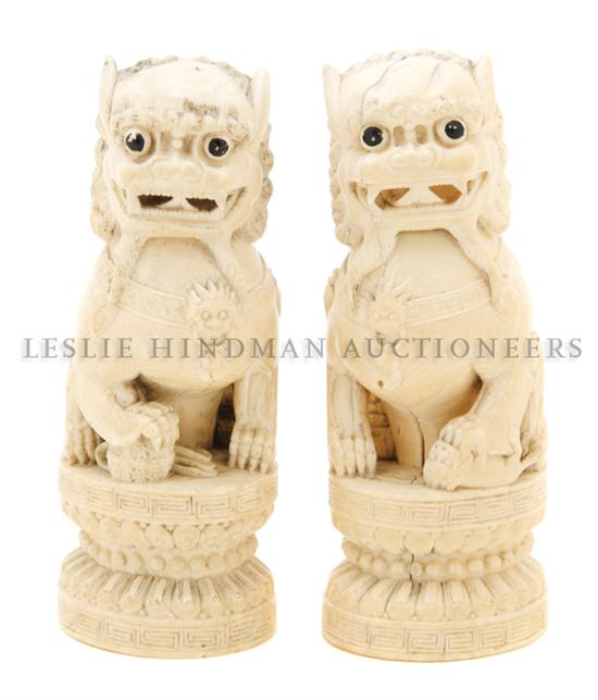 A Pair of Chinese Carved Ivory Fu