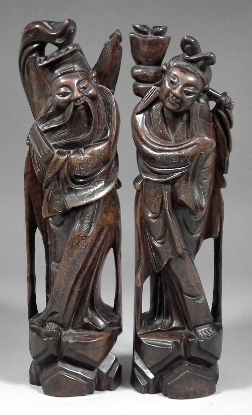 A pair of Chinese hardwood carvings