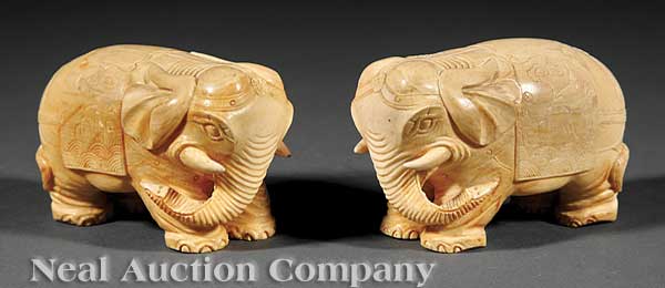 A Pair of Chinese Ivory Elephants