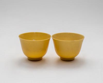 A pair of Chinese yellow glazed tea