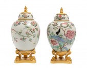 A PAIR OF CHINOISERIE LIDDED P
