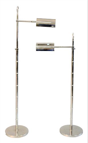 A PAIR OF CHROME ADJUSTABLE FLOOR