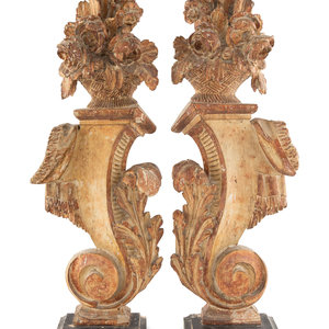 A Pair of Continental Carved and
