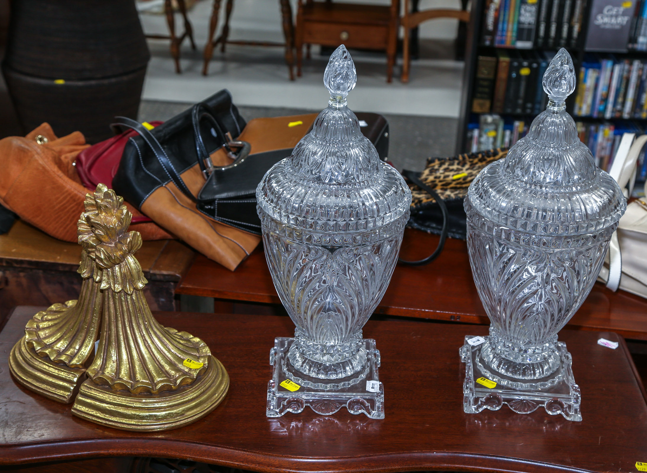 A PAIR OF CRYSTAL COVERED URNS &