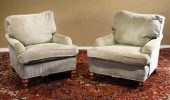 A pair of custom upholstered c