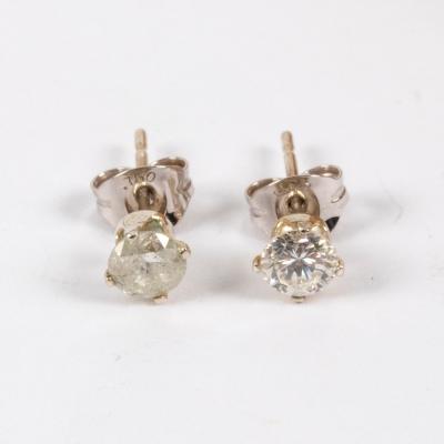 A pair of diamond ear studs, the