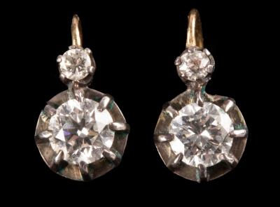 A pair of diamond earrings, each