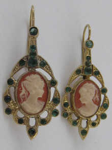 A pair of drop earrings set with