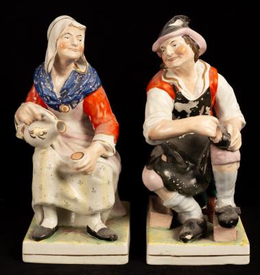 A pair of earthenware figures of