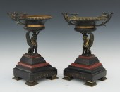 A Pair of Egyptian Revival Com