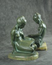A PAIR OF FIGURAL BRONZE BOOKE