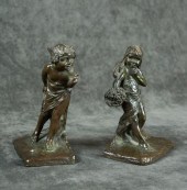 A PAIR OF FIGURAL SOLID BRONZE
