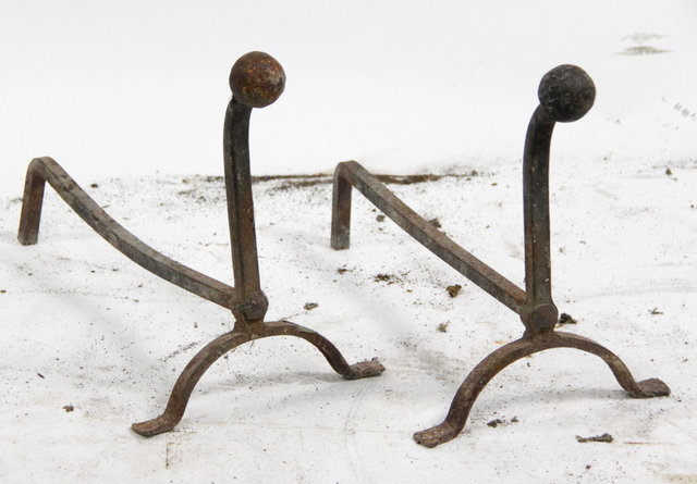 A pair of fire dogs with ball