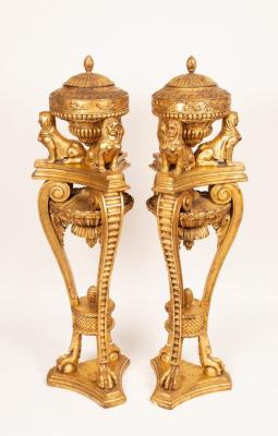 A pair of French style urns and