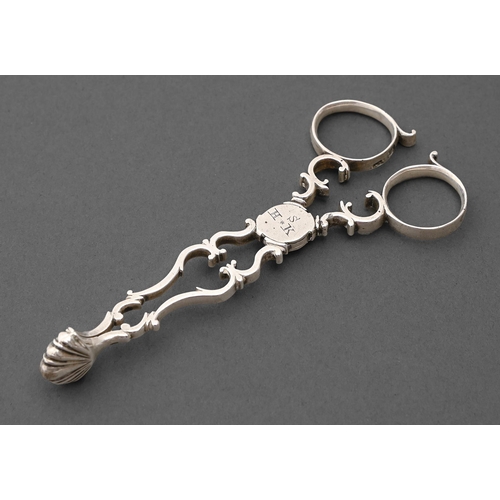A pair of George III silver sugar