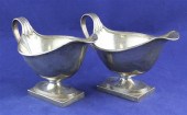A pair of George V silver sauc