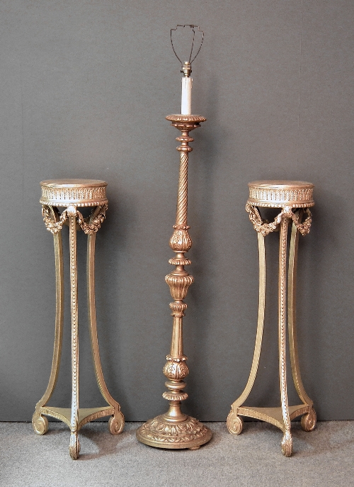 A pair of gilt circular torcheres