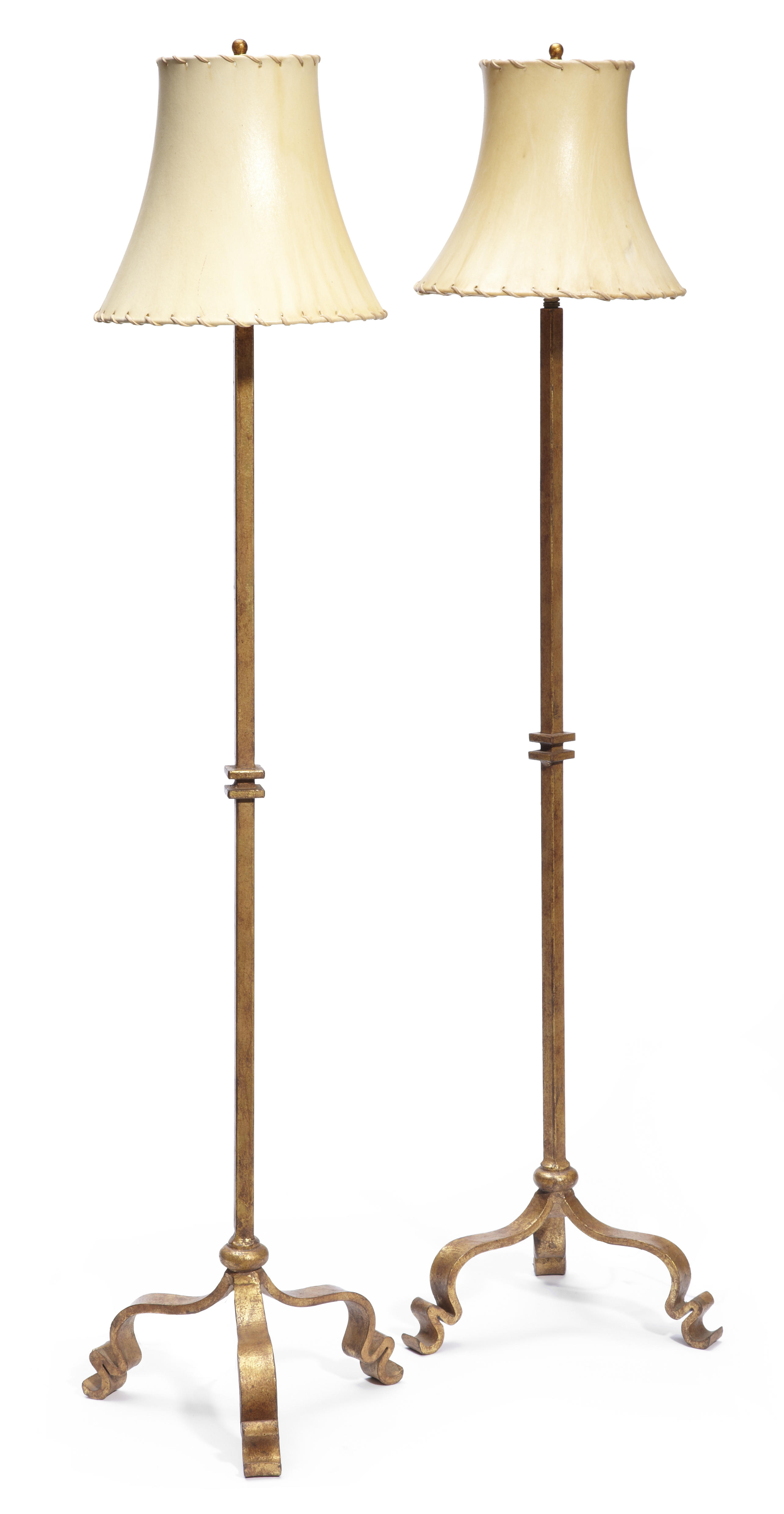 A pair of gilt metal floor lamps