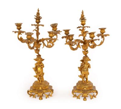 A pair of gilt metal candelabra