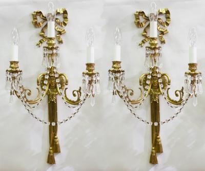 A pair of gilt metal three-branch