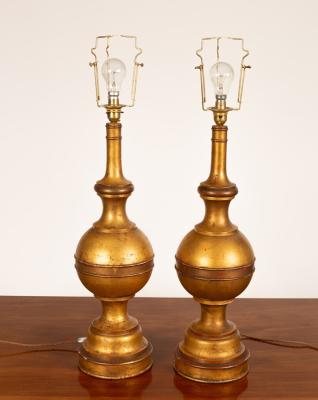 A pair of gilt table lamps of