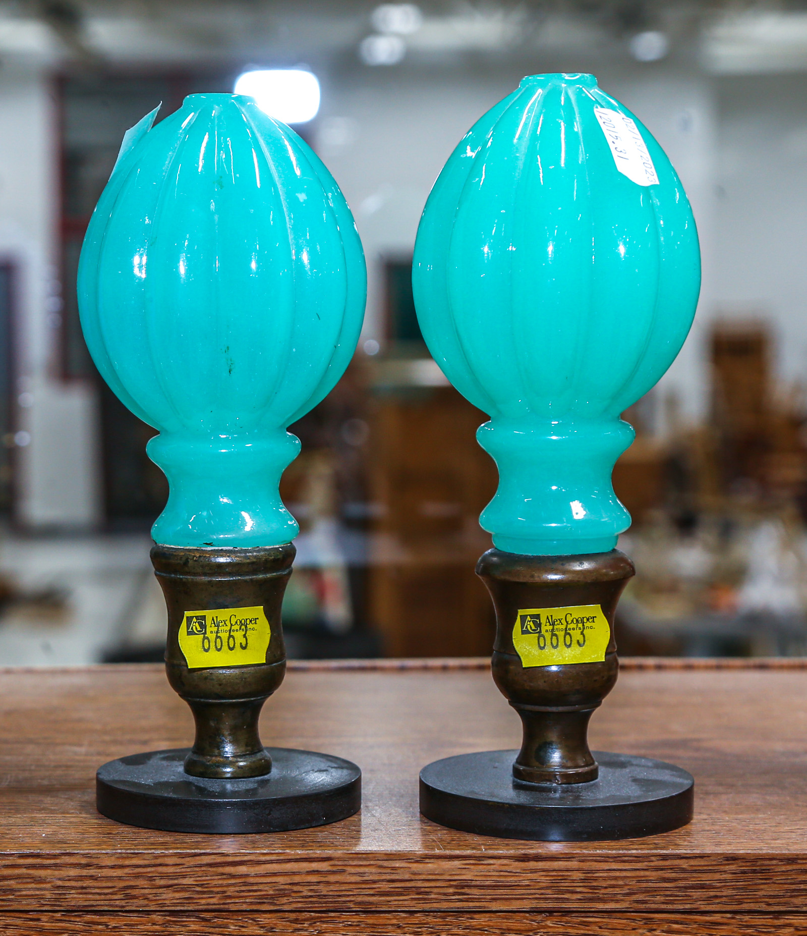 A PAIR OF GLASS BANISTER OR NEWEL