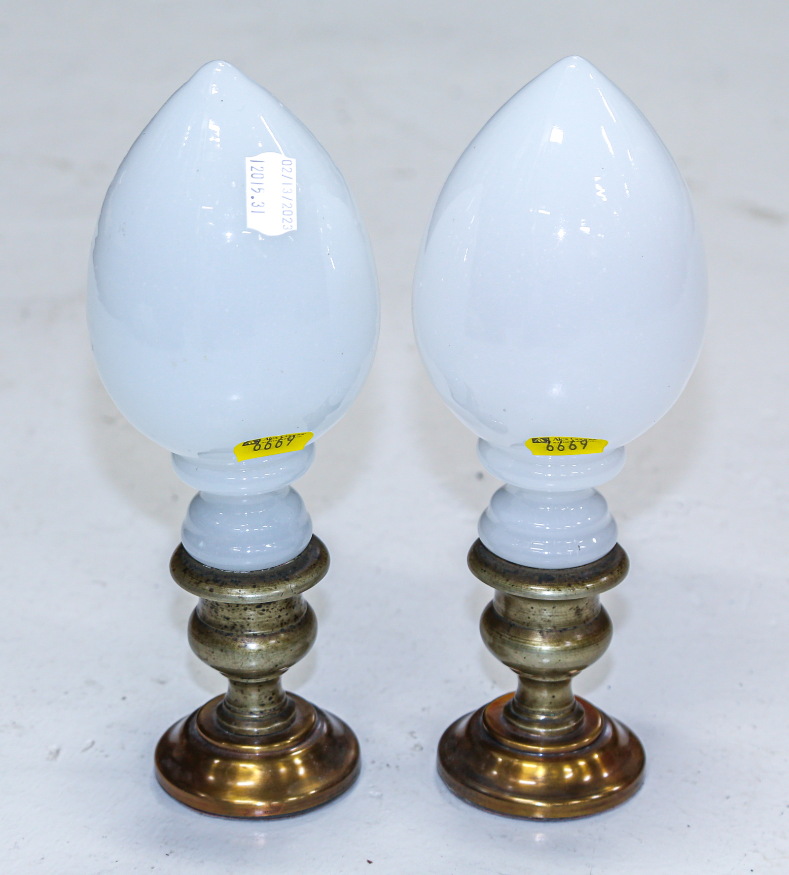 A PAIR OF GLASS BANISTER OR NEWEL