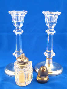 A pair of glass candlesticks with